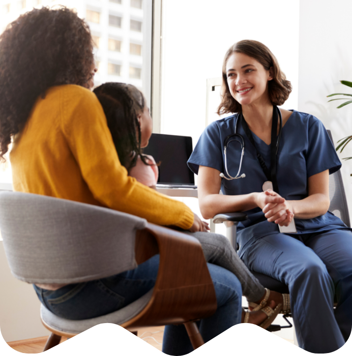 Doctor with patient and parent sitting