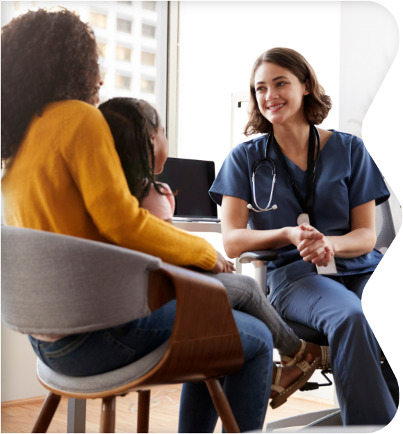Doctor with patient and parent sitting