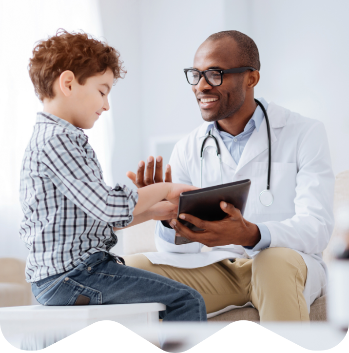 Boy with doctor in exam room