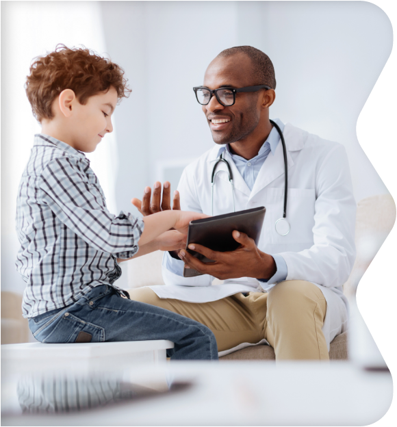 Boy with doctor in exam room