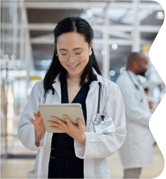 Doctor looking at resources on tablet
