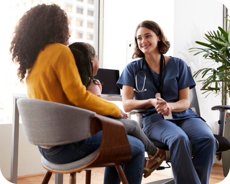 Doctor with patient and parent sitting