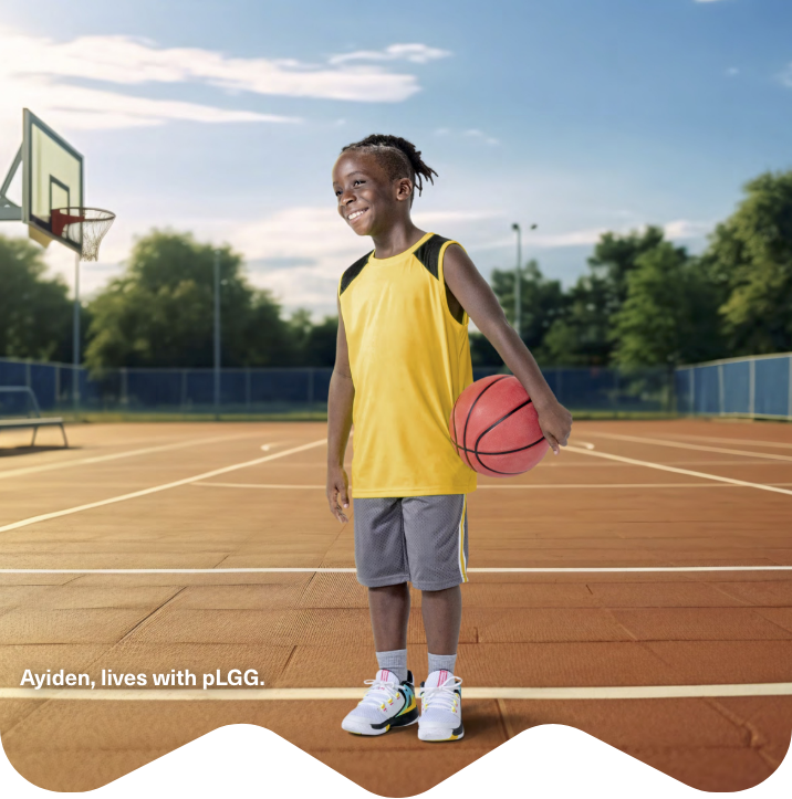 Ayiden, lives with pLGG, holding a basketball