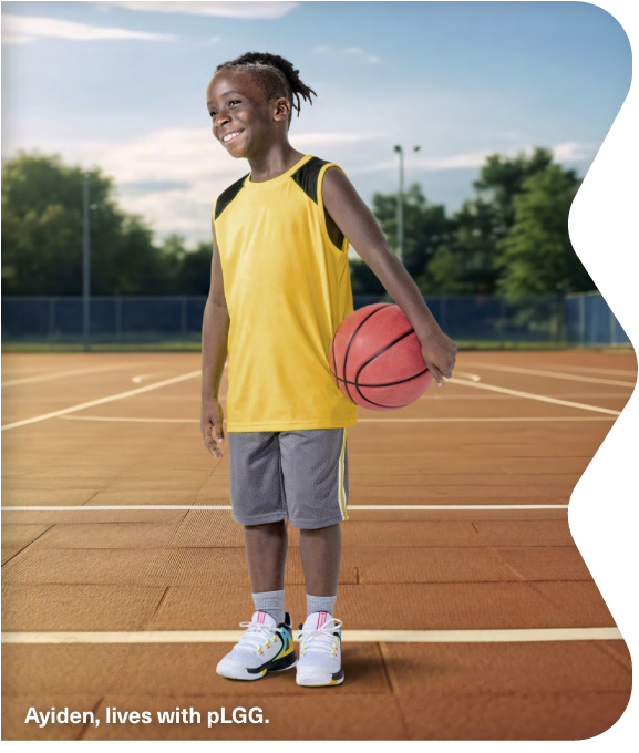 Ayiden, lives with pLGG, holding a basketball