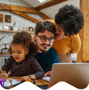 Family with child around a computer